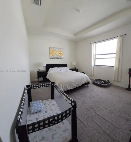 a bedroom with furniture and a bed