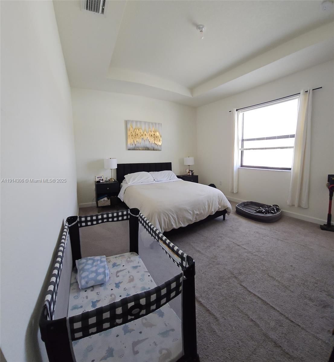 3387 West 106th Terrace, Unit 3387 Hialeah, FL 33018 - Photo 12 of 20 a bedroom with furniture and a bed