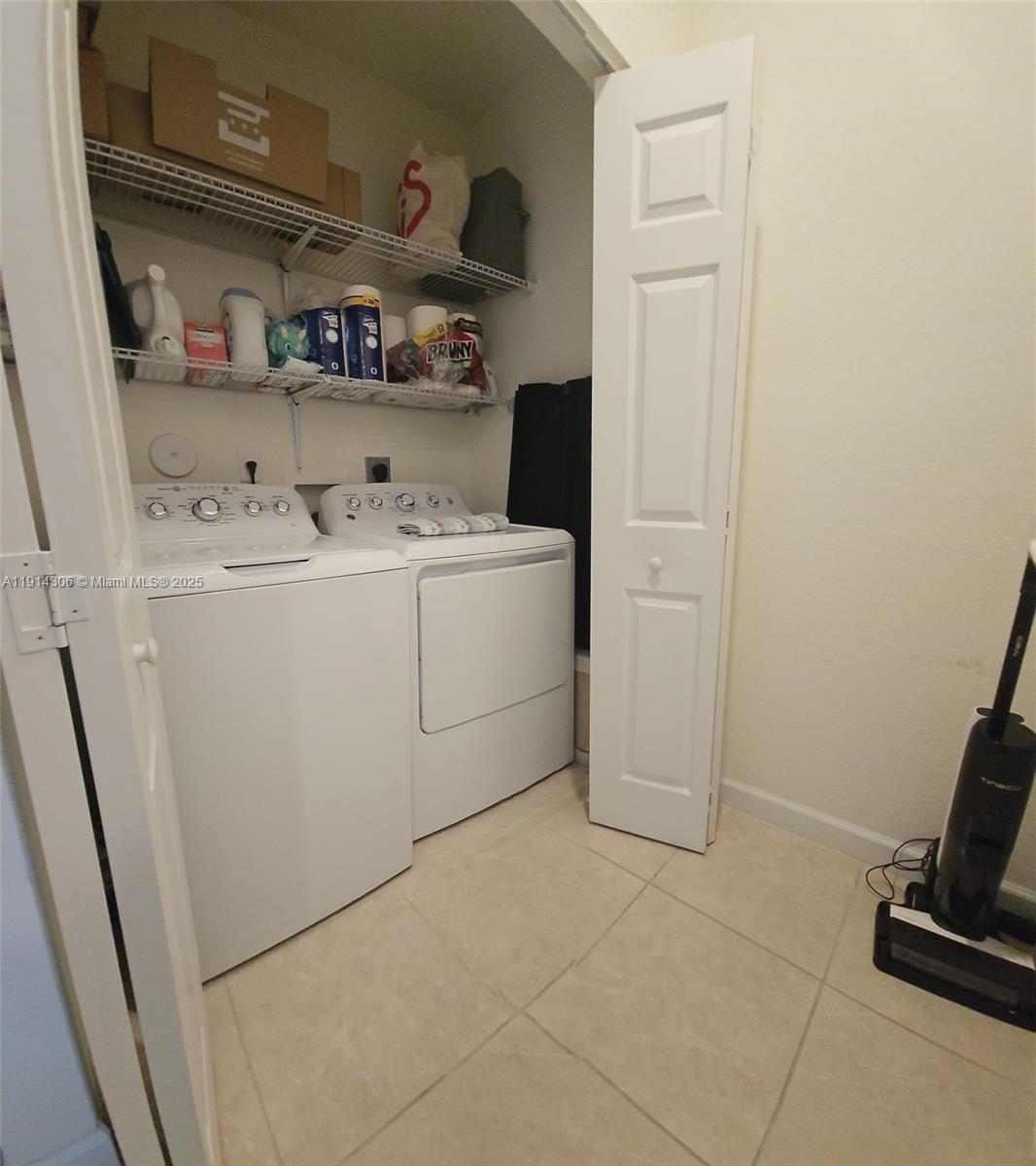 3387 West 106th Terrace, Unit 3387 Hialeah, FL 33018 - Photo 10 of 20 a utility room with dryer and washer