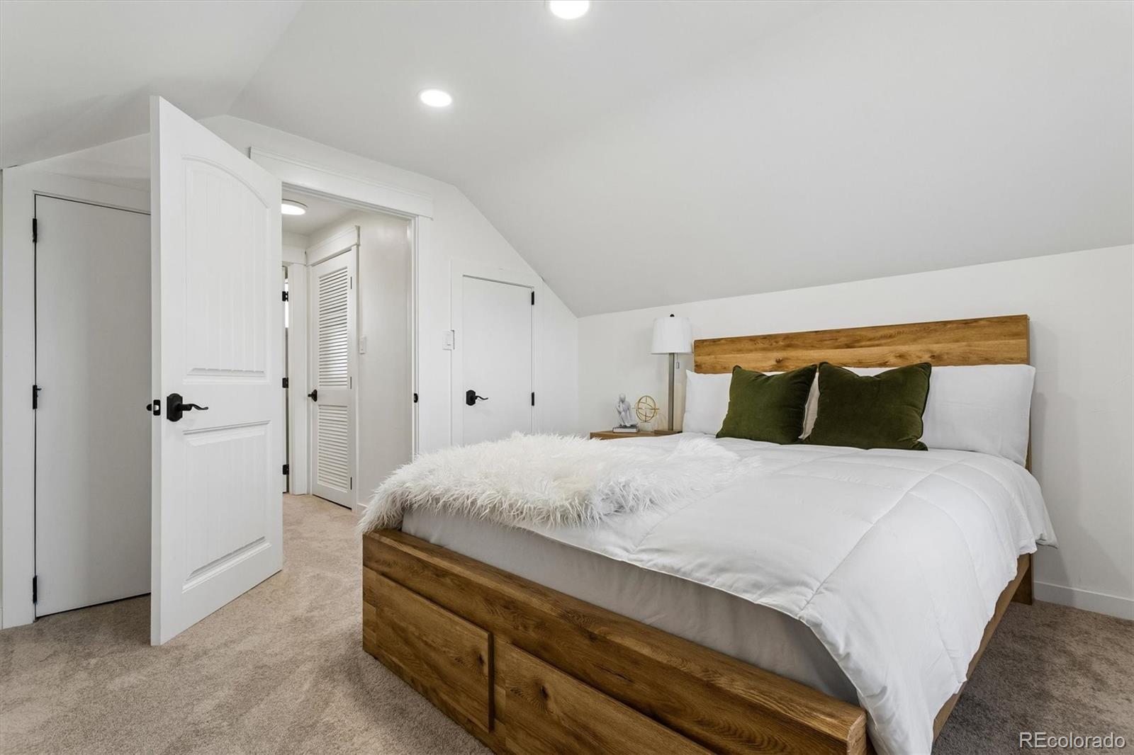 2293 Fenton Street Edgewater, CO 80214 - Photo 12 of 18 a bedroom with a bed and a painting