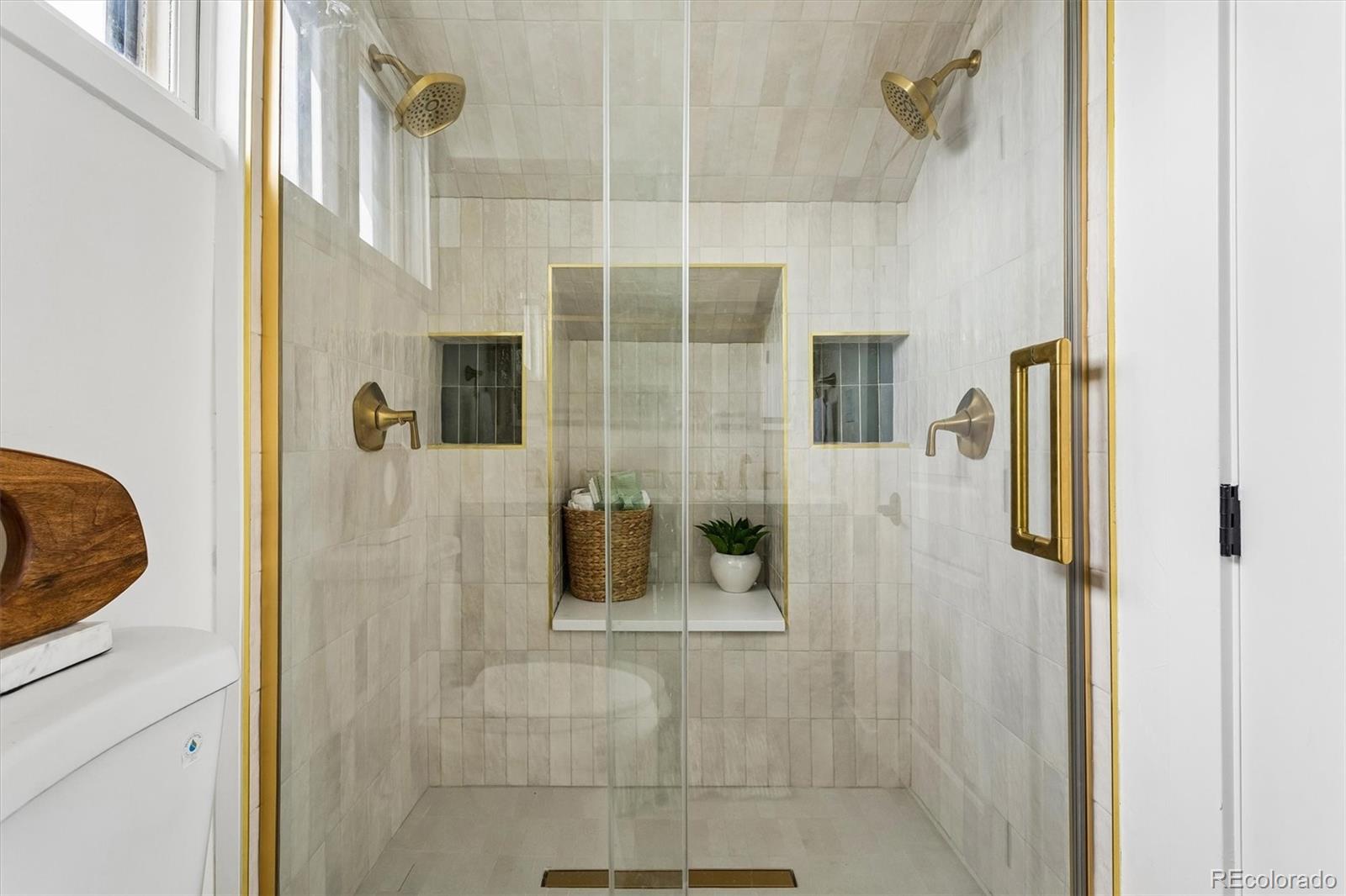 2293 Fenton Street Edgewater, CO 80214 - Photo 14 of 18 a bathroom with a shower
