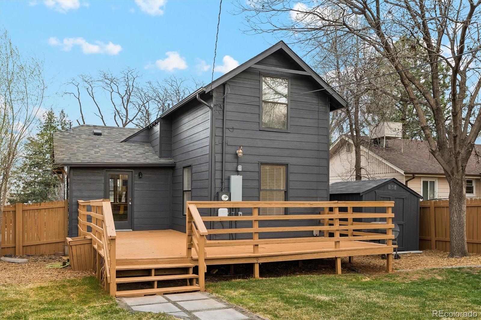 2293 Fenton Street Edgewater, CO 80214 - Photo 16 of 18 a backyard of a house with barbeque oven and outdoor seating