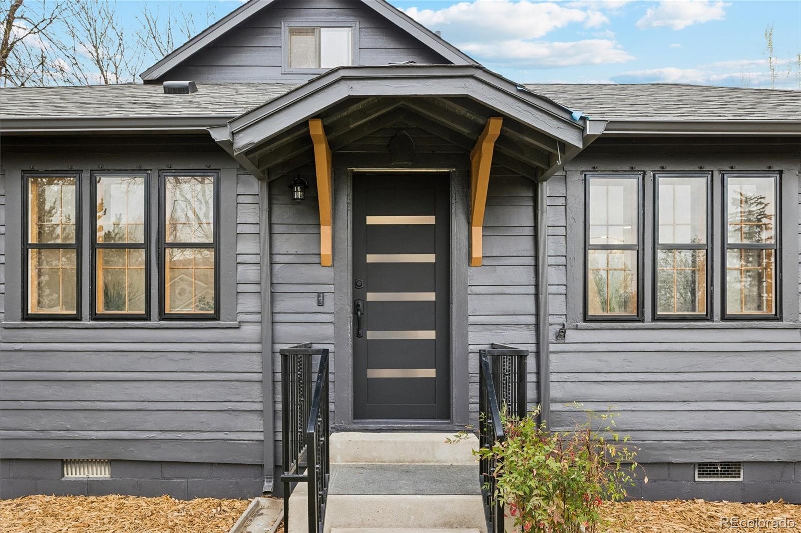2293 Fenton Street Edgewater, CO 80214 - Photo 18 of 18 a front view of a house with a glass windows