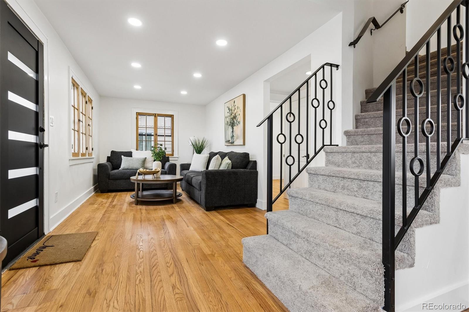 2293 Fenton Street Edgewater, CO 80214 - Photo 2 of 18 a living room with furniture and a wooden floor