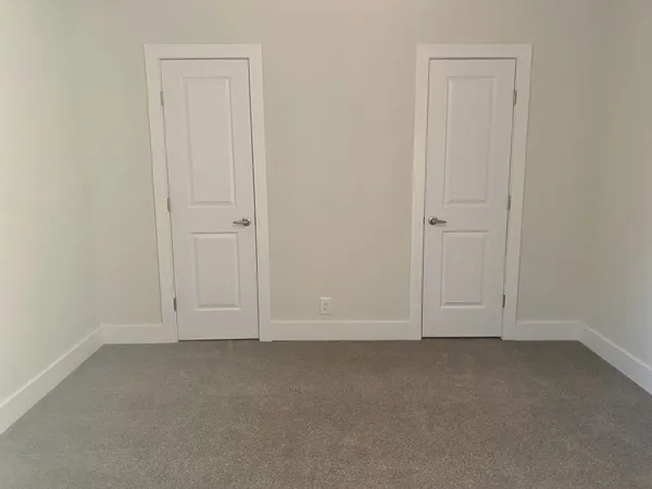 an empty room with white door