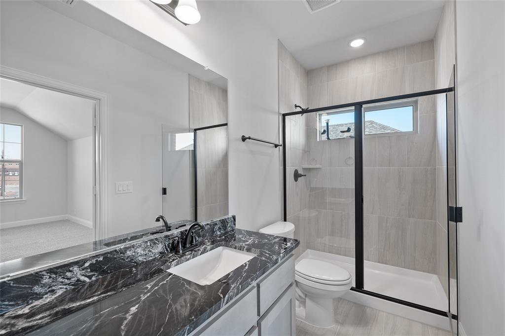 613 Brazos Drive Van Alstyne, TX 75495 - Photo 22 of 29 Bathroom featuring vanity, a shower stall, and recessed lighting