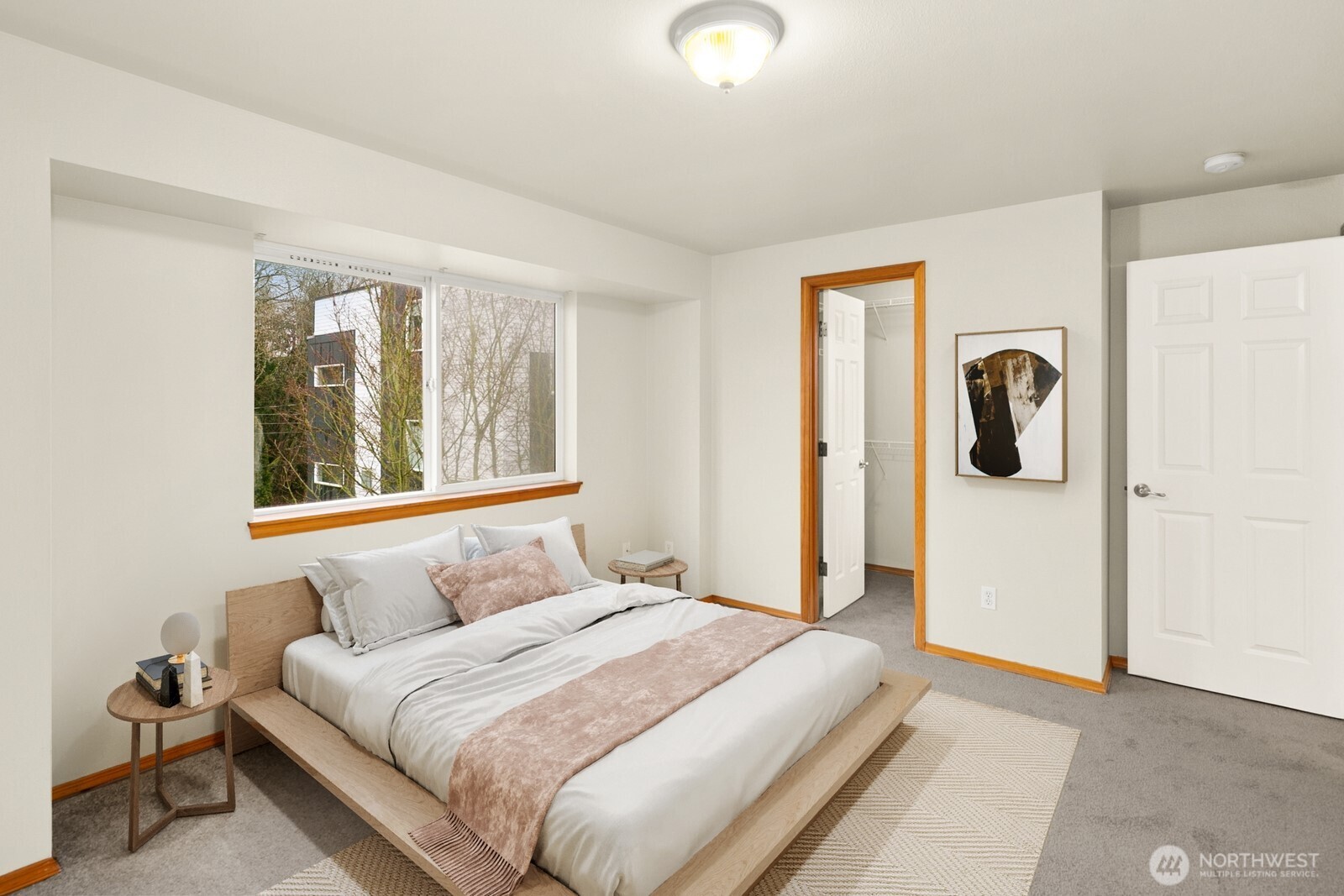1417 North 97th Street Seattle, WA 98103 - Photo 12 of 23 a bedroom with a bed and windows