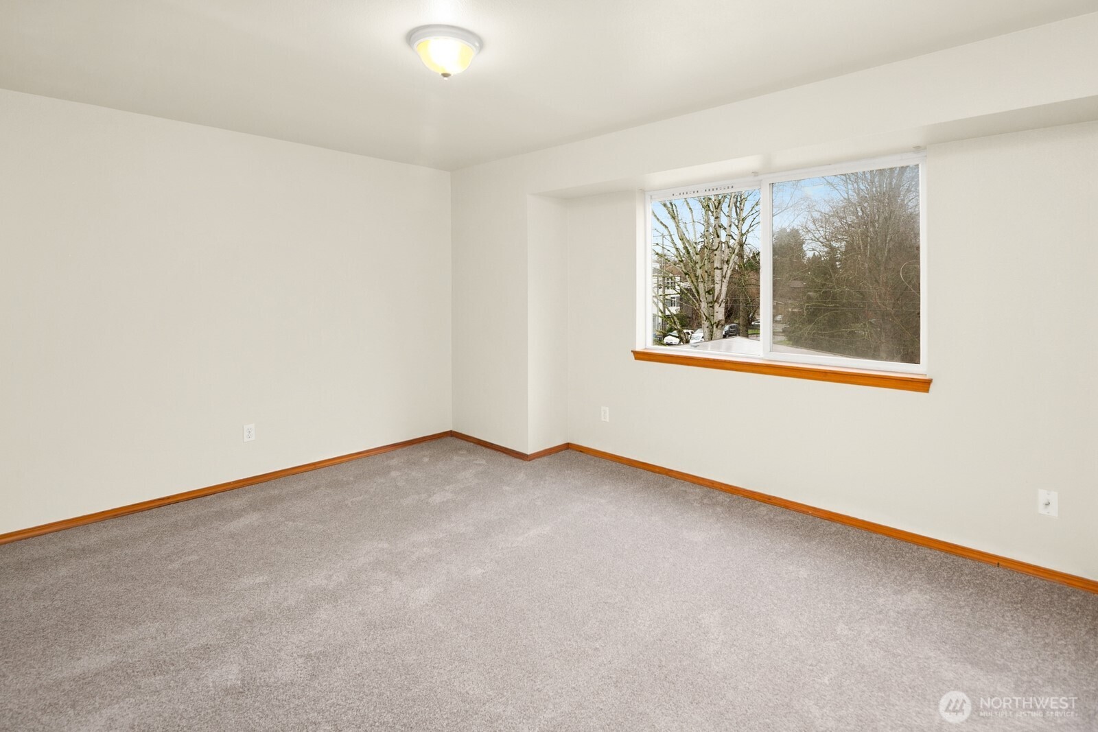 1417 North 97th Street Seattle, WA 98103 - Photo 15 of 23 an empty room with a window