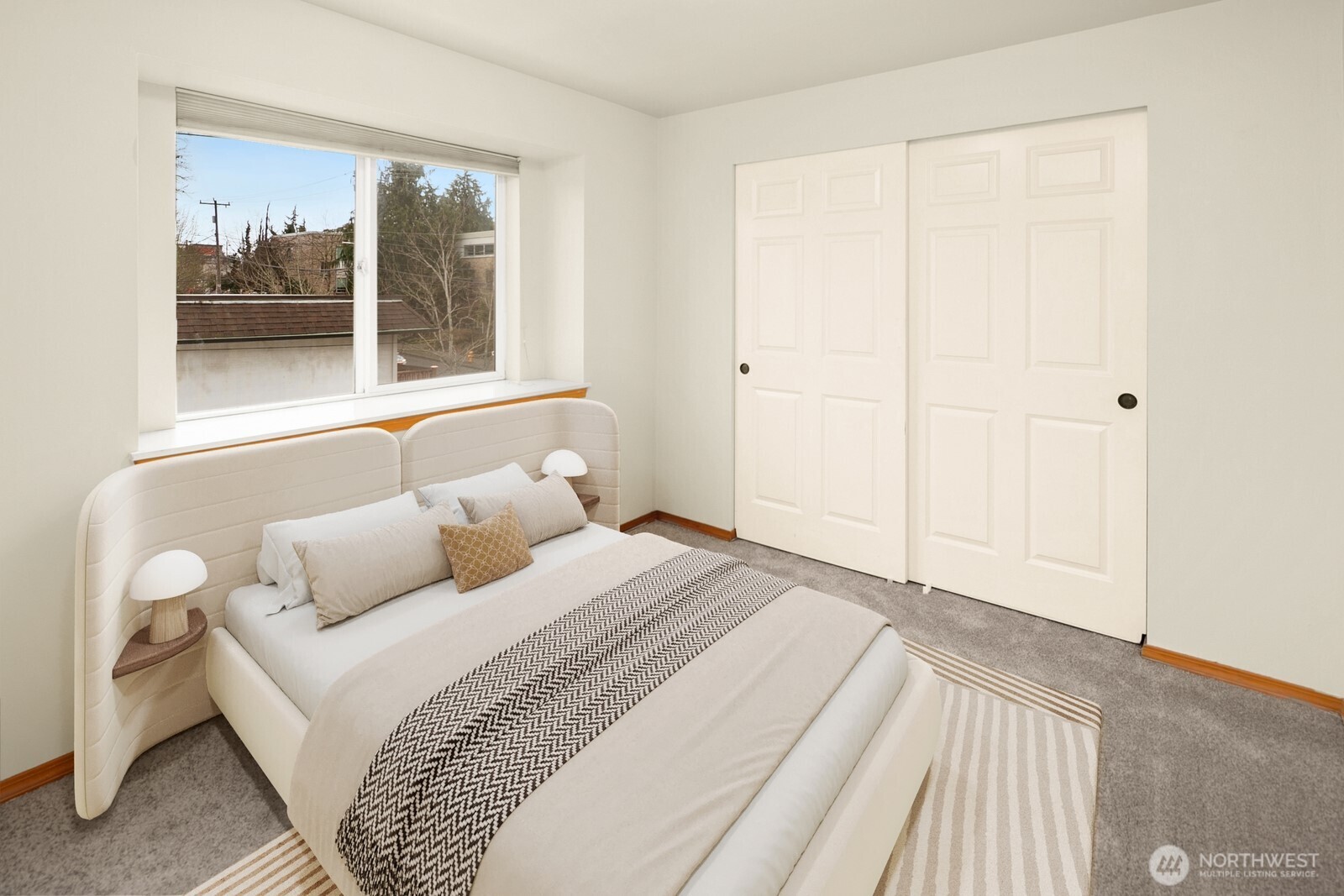 1417 North 97th Street Seattle, WA 98103 - Photo 17 of 23 a bedroom with a bed and a window