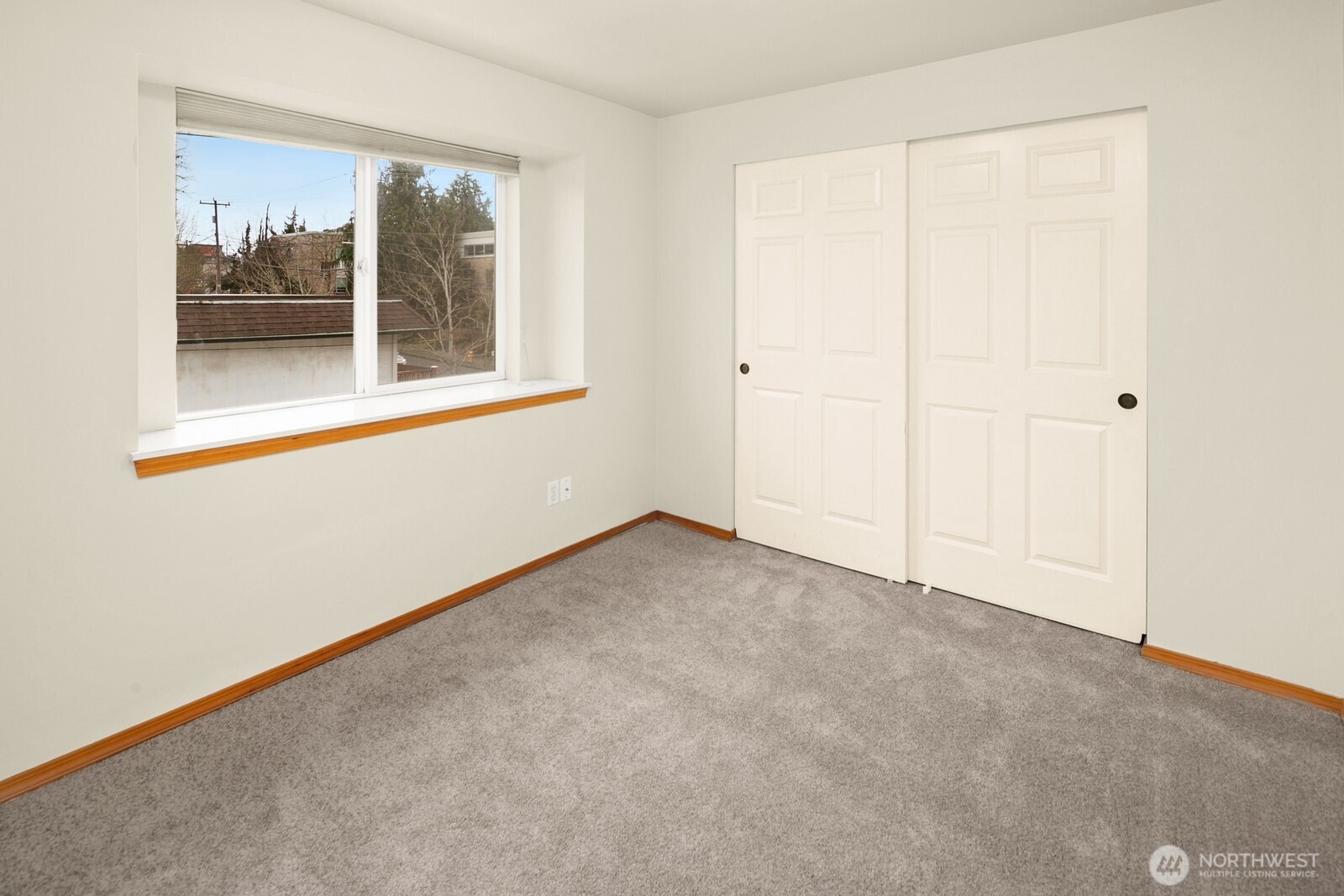 1417 North 97th Street Seattle, WA 98103 - Photo 18 of 23 an empty room with a window