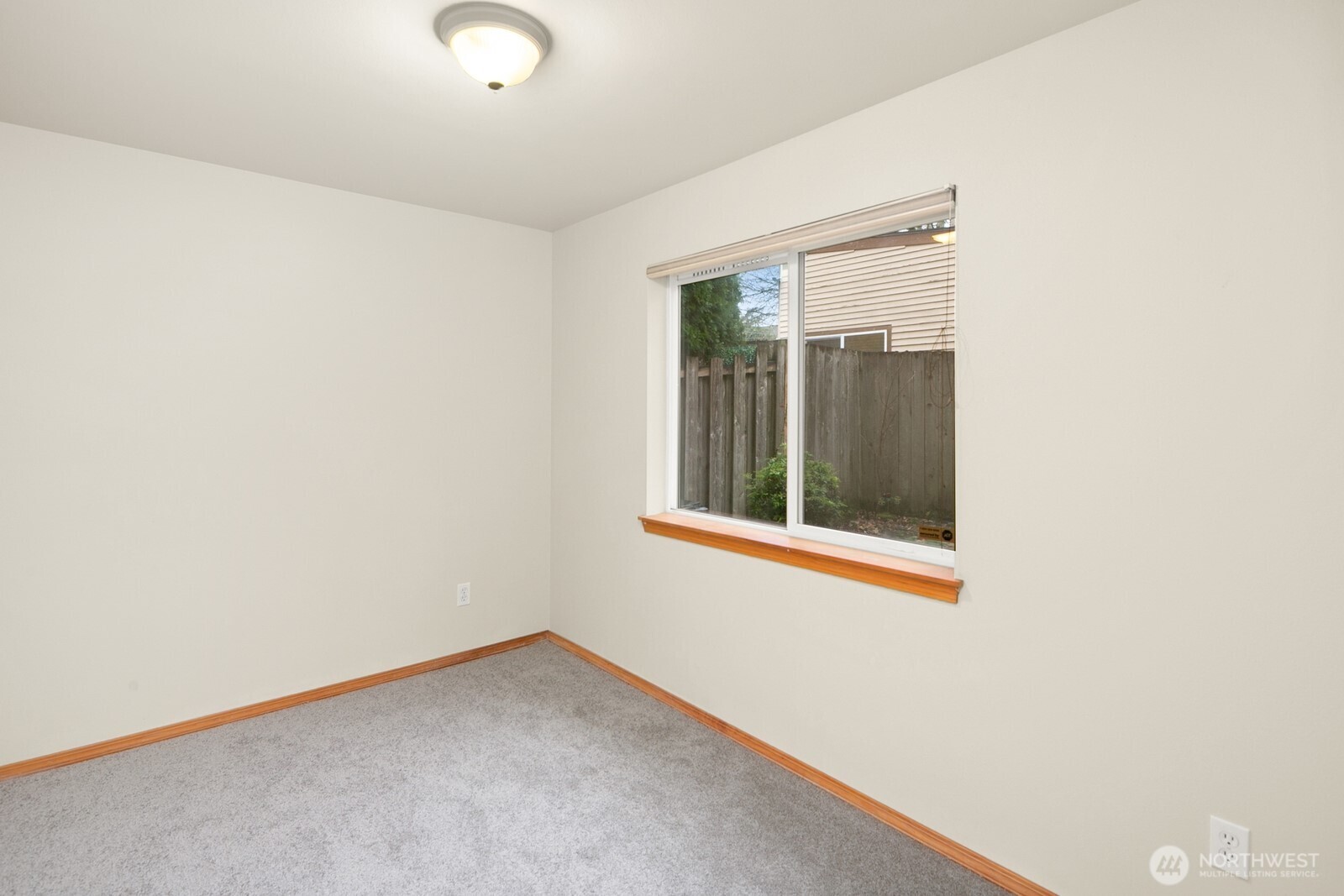 1417 North 97th Street Seattle, WA 98103 - Photo 19 of 23 a view of an empty room with a window