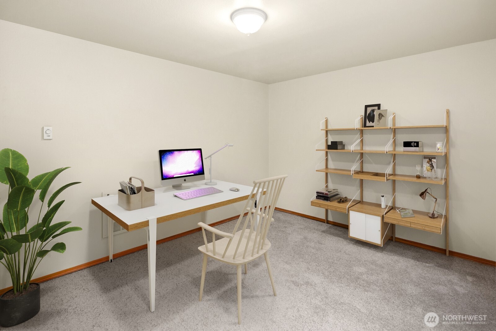 1417 North 97th Street Seattle, WA 98103 - Photo 20 of 23 a workspace with furniture and white walls