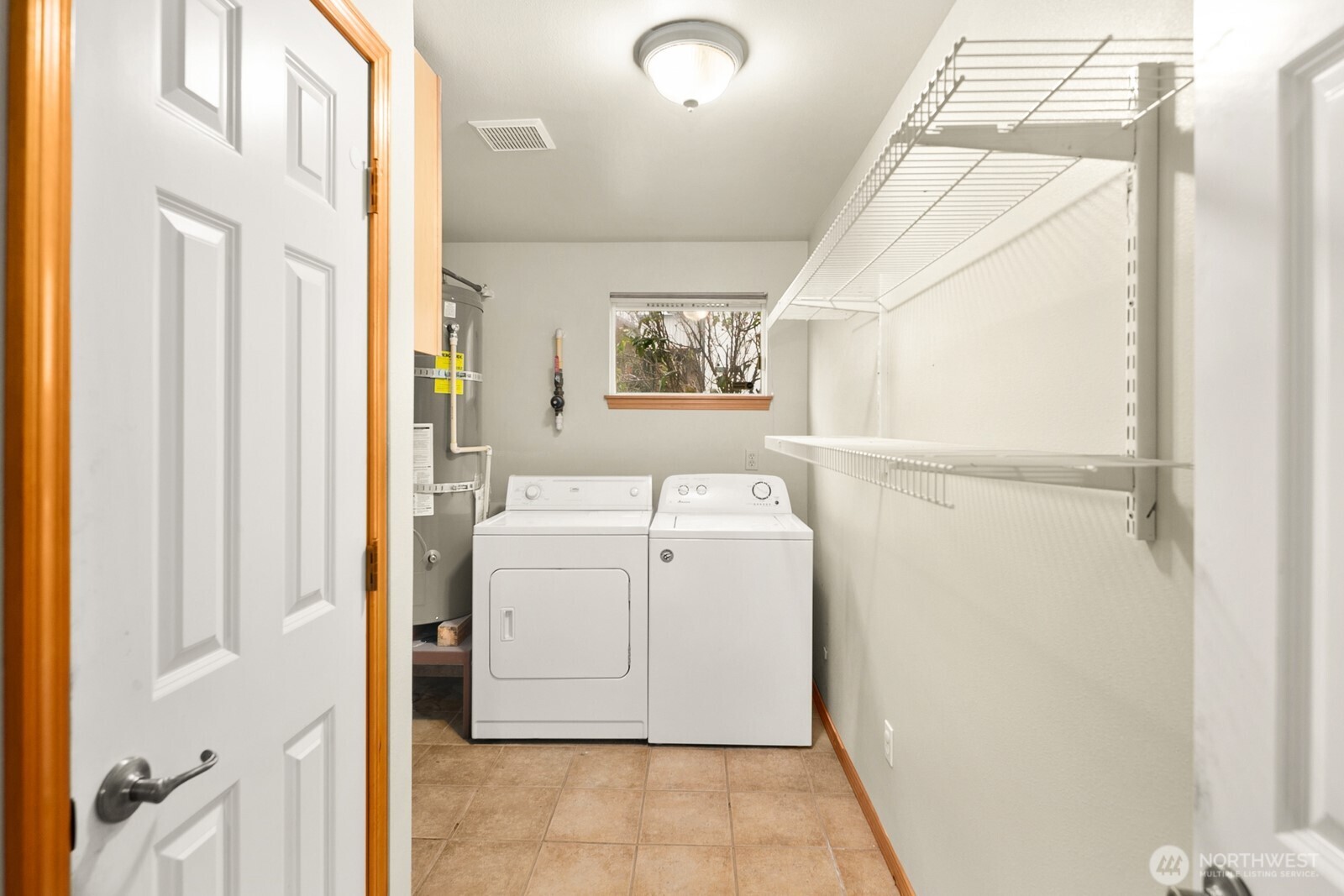 1417 North 97th Street Seattle, WA 98103 - Photo 23 of 23 a utility room with a washer dryer and washer