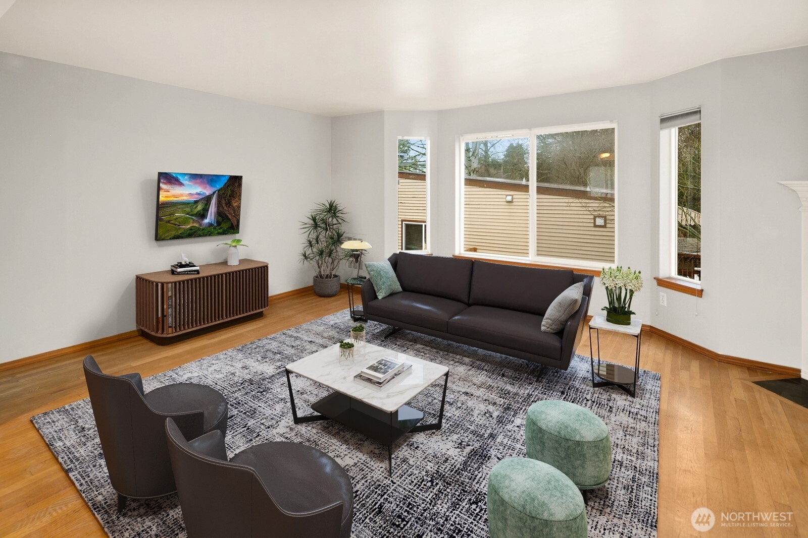 1417 North 97th Street Seattle, WA 98103 - Photo 10 of 23 a living room with furniture and a flat screen tv