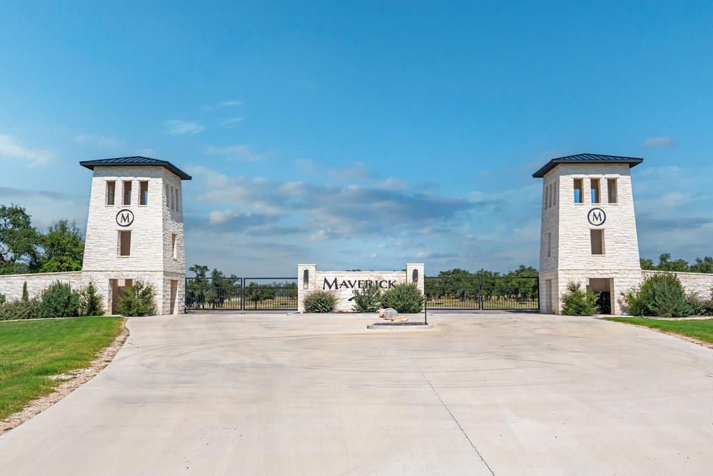 Lot 100 Packsaddle Drive Harper, TX 78631 - Photo 1 of 32 a front view of a house with a yard