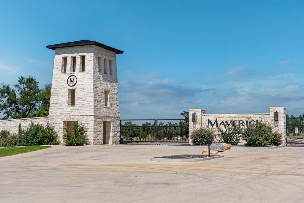 Lot 100 Packsaddle Drive Harper, TX 78631 - Photo 28 of 32 a front view of a house with a yard