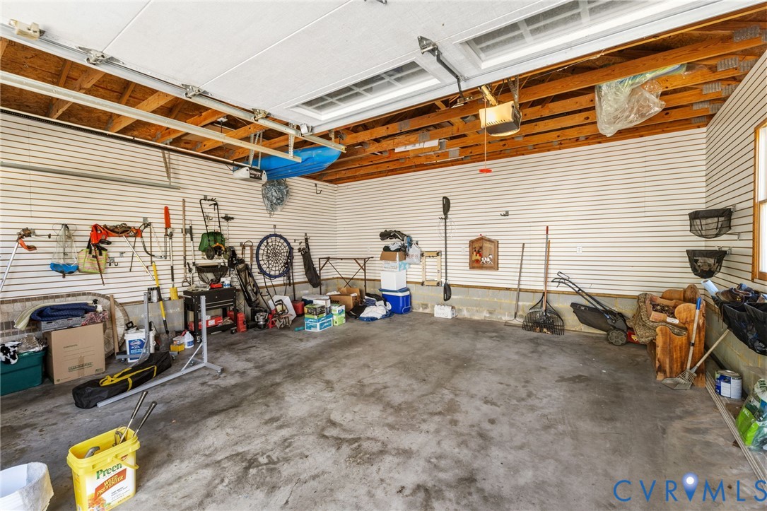 8947 Cherokee Road Richmond, VA 23235 - Photo 42 of 45 a view of a garage with parked cars
