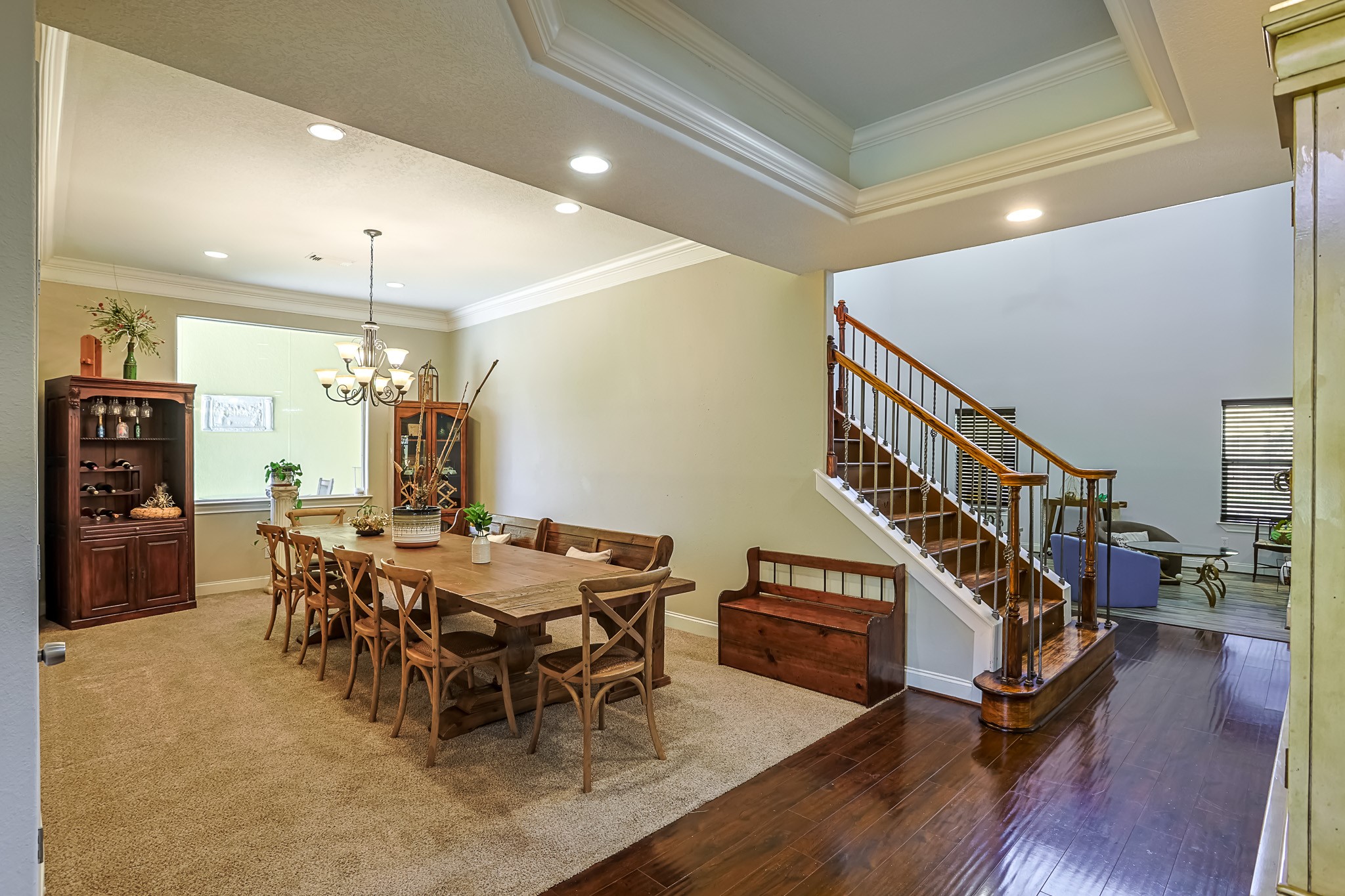 30119 West Geneva Drive Spring, TX 77386 - Photo 8 of 35 Spacious formal dining room designed for gatherings, featuring tray ceilings, wood accents, and an open flow into the main living area.