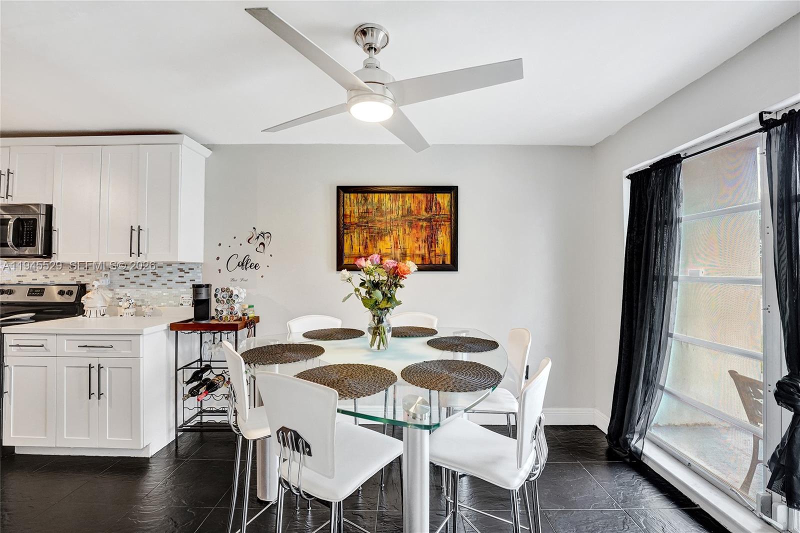 3301 Raleigh Street, Unit 4E Hollywood, FL 33021 - Photo 11 of 80 a view of a dining room with furniture window and wooden floor