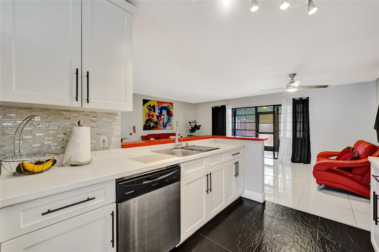 3301 Raleigh Street, Unit 4E Hollywood, FL 33021 - Photo 17 of 80 a kitchen with stainless steel appliances granite countertop a sink and cabinets