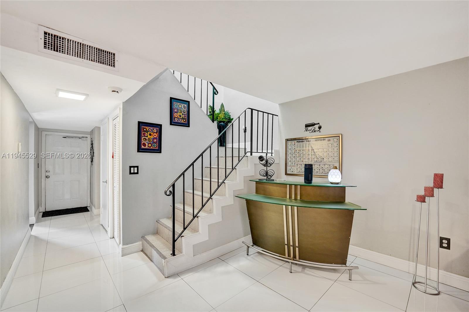3301 Raleigh Street, Unit 4E Hollywood, FL 33021 - Photo 28 of 80 a view of a livingroom with furniture and stairs