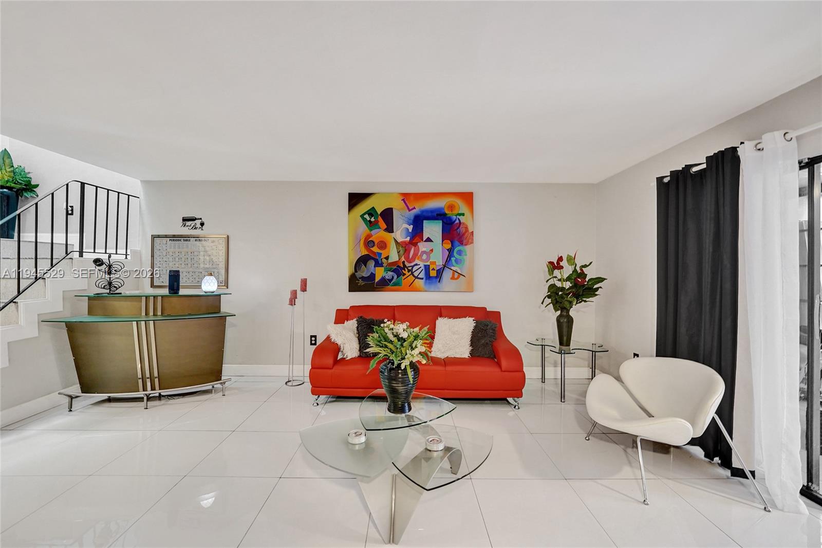 3301 Raleigh Street, Unit 4E Hollywood, FL 33021 - Photo 31 of 80 a living room with furniture a rug and a painting