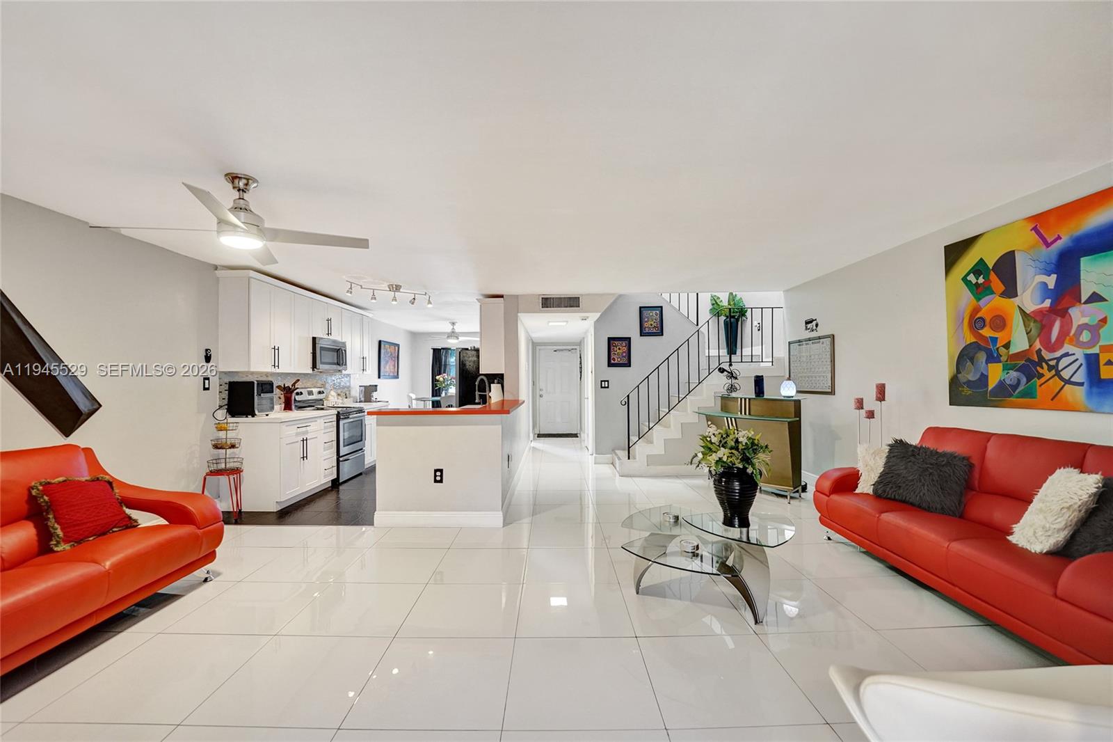 3301 Raleigh Street, Unit 4E Hollywood, FL 33021 - Photo 33 of 80 a living room with furniture and kitchen view