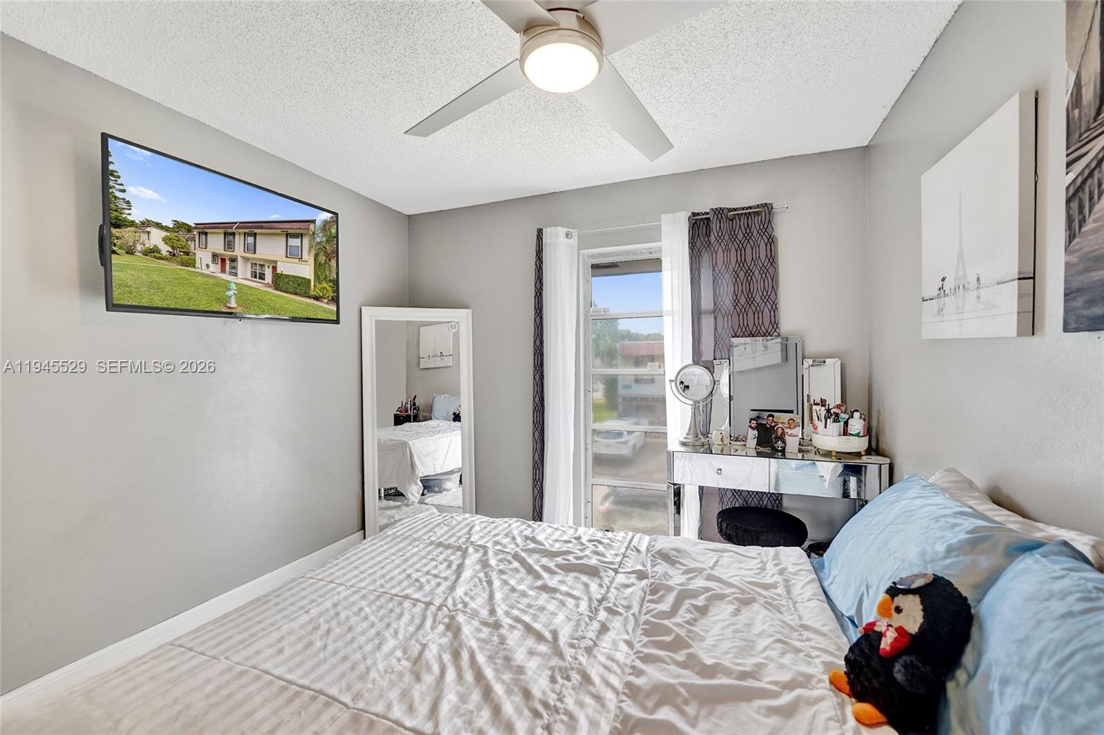 3301 Raleigh Street, Unit 4E Hollywood, FL 33021 - Photo 49 of 80 a bedroom with a bed and a view of kitchen