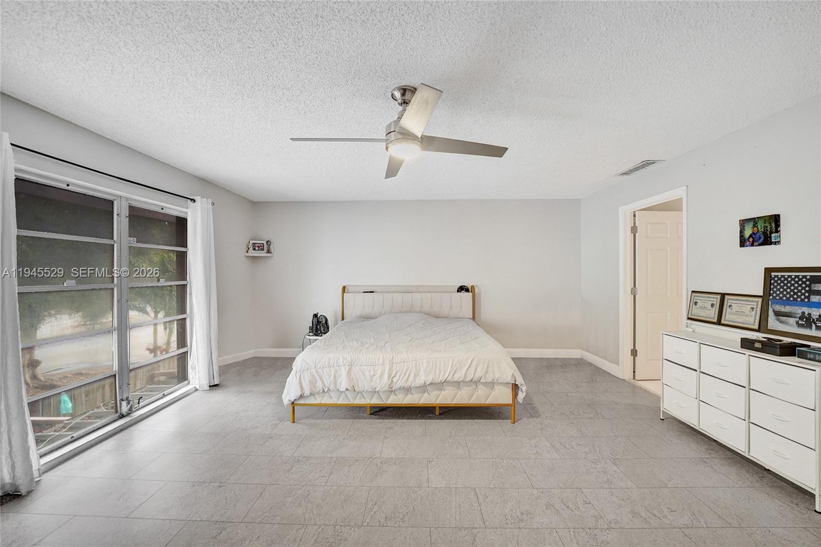 3301 Raleigh Street, Unit 4E Hollywood, FL 33021 - Photo 62 of 80 a large white bed in a white room