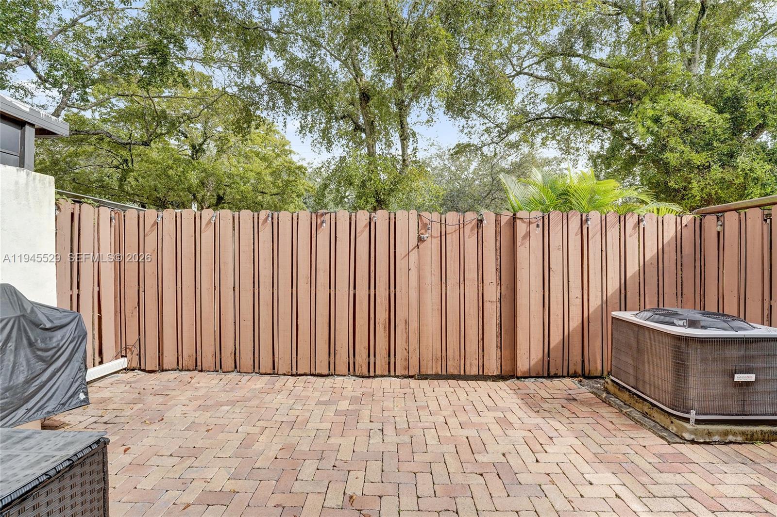 3301 Raleigh Street, Unit 4E Hollywood, FL 33021 - Photo 70 of 80 a view of outdoor space with wooden fence