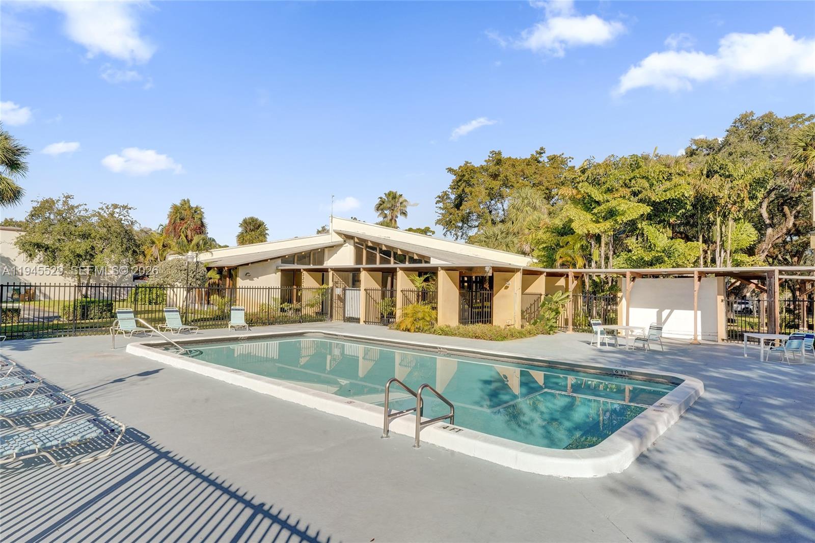 3301 Raleigh Street, Unit 4E Hollywood, FL 33021 - Photo 80 of 80 a front view of a house with a swimming pool