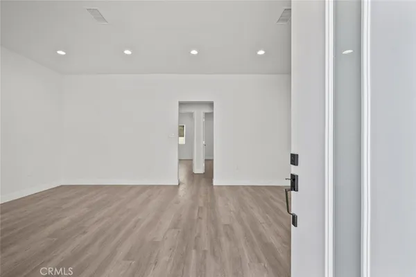 a view of a livingroom with wooden floor