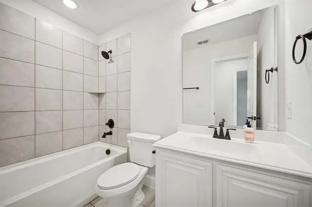 a bathroom with a sink a toilet and a bathtub
