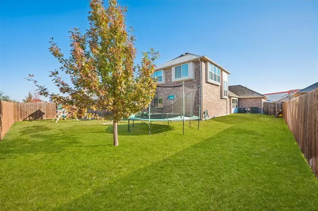 a house view with swimming pool