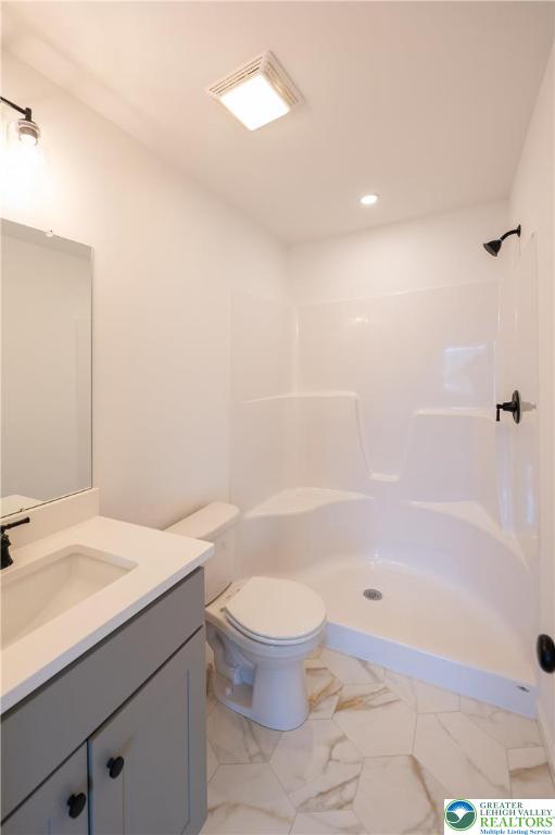 560 Long Street, Unit 4 Emmaus, PA 18049 - Photo 13 of 16 a bathroom with a sink a toilet and shower