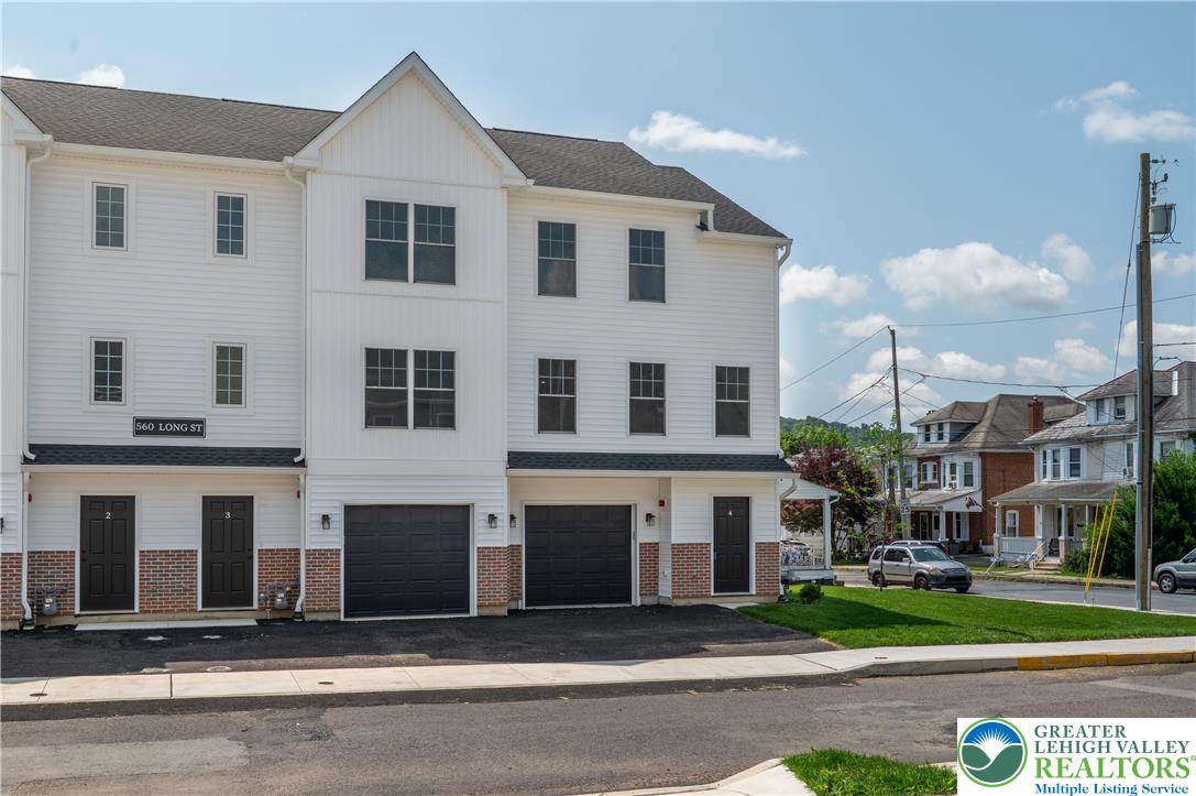 560 Long Street, Unit 4 Emmaus, PA 18049 - Photo 2 of 16 a front view of a house with a garden