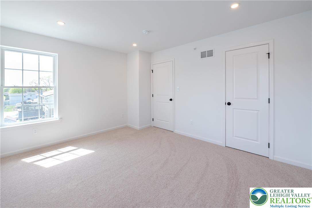 560 Long Street, Unit 4 Emmaus, PA 18049 - Photo 8 of 16 a view of empty room with window