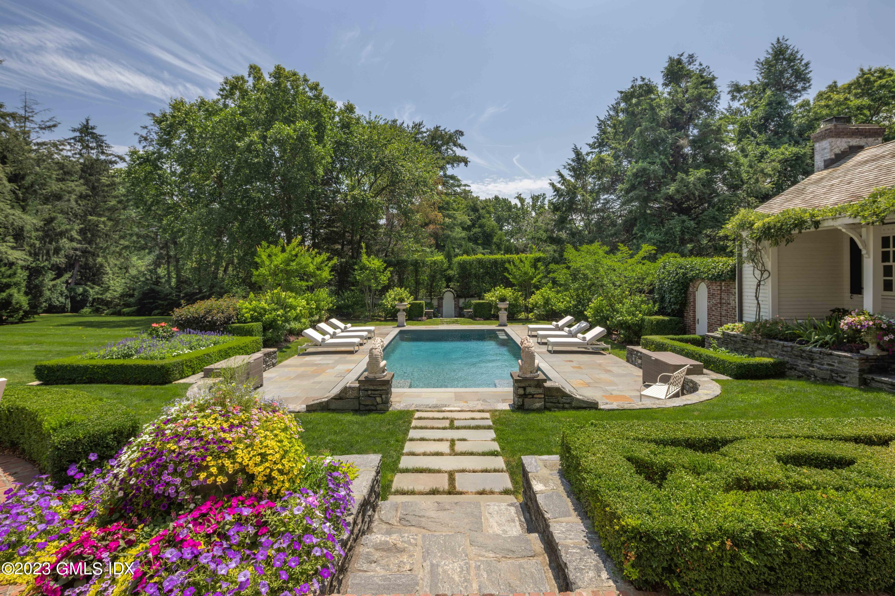 80 Round Hill Road Greenwich, CT 06831 - Photo 1 of 57 a view of a house with garden