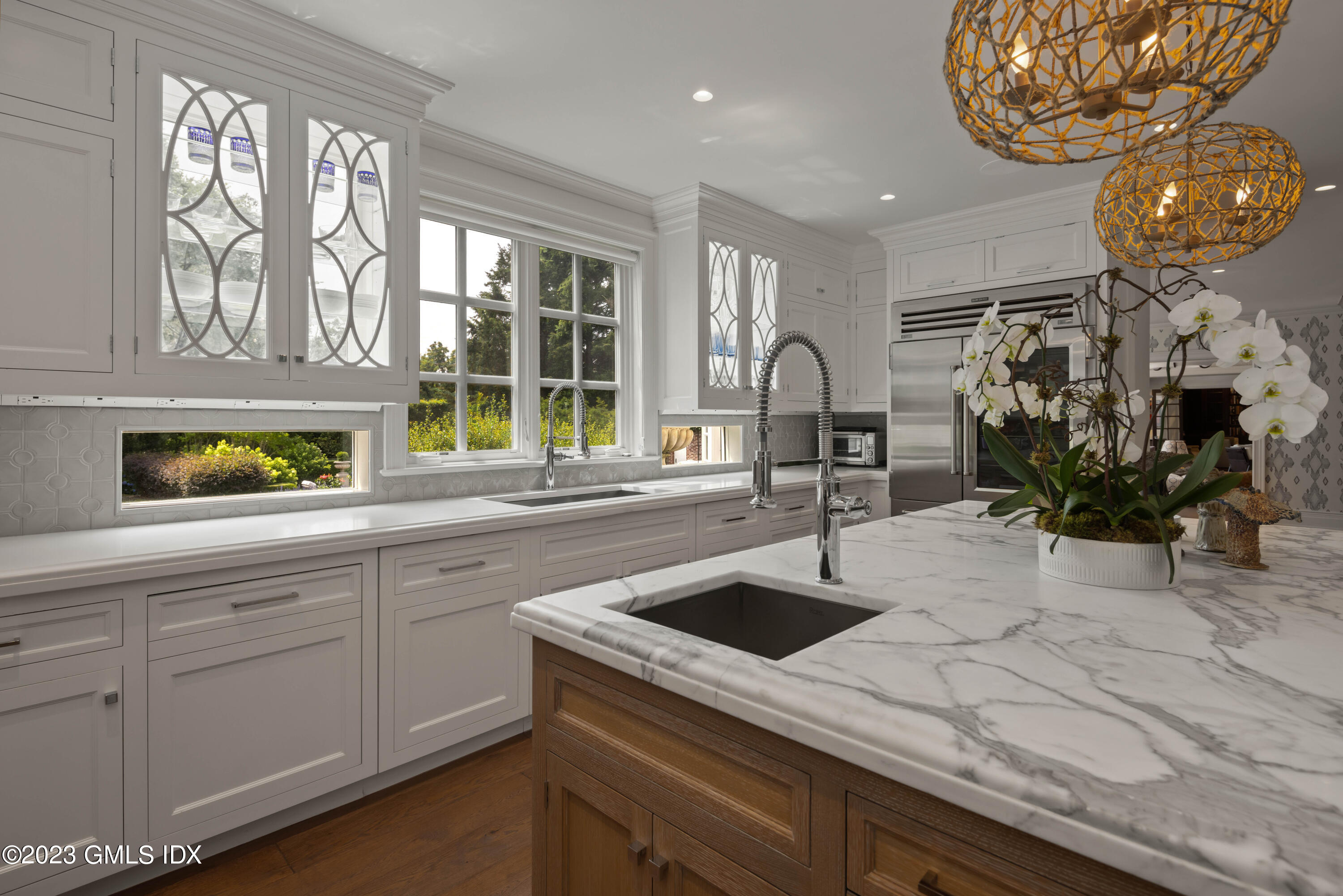 80 Round Hill Road Greenwich, CT 06831 - Photo 13 of 57 a kitchen with stainless steel appliances a sink a counter space and cabinets