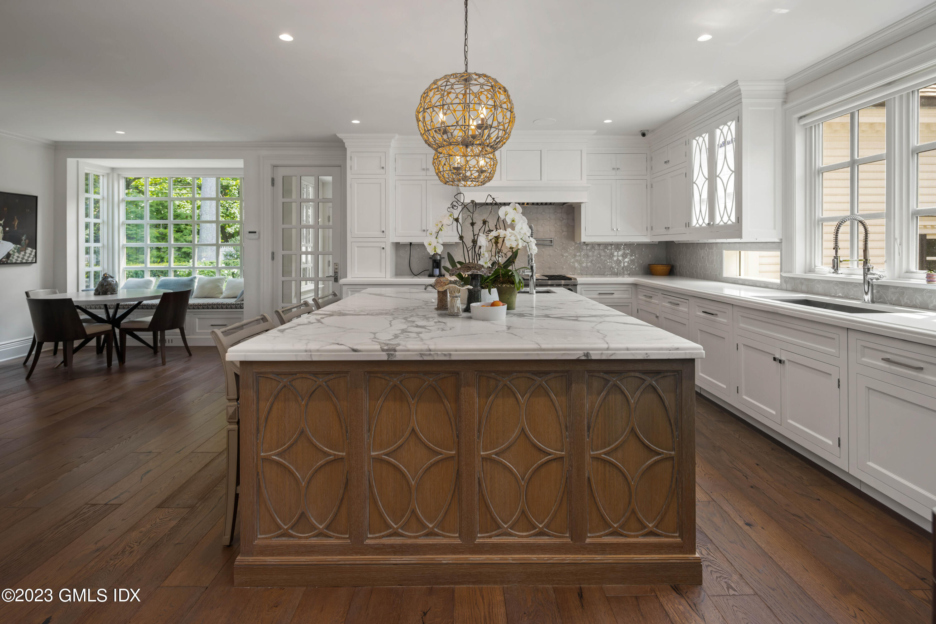 80 Round Hill Road Greenwich, CT 06831 - Photo 14 of 57 a kitchen with a dining table chairs wooden floor and appliances