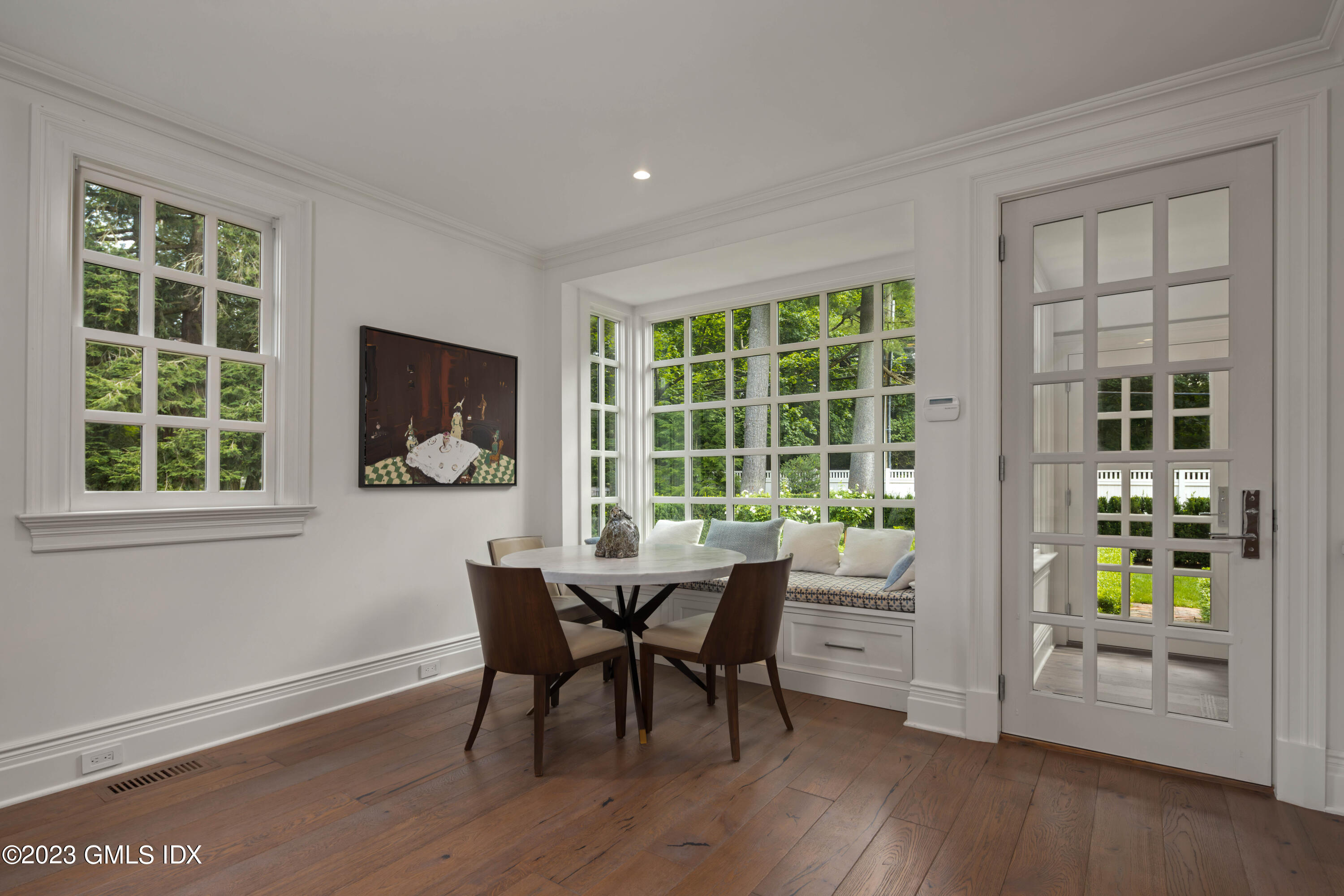 80 Round Hill Road Greenwich, CT 06831 - Photo 16 of 57 a workspace with wooden floor and windows