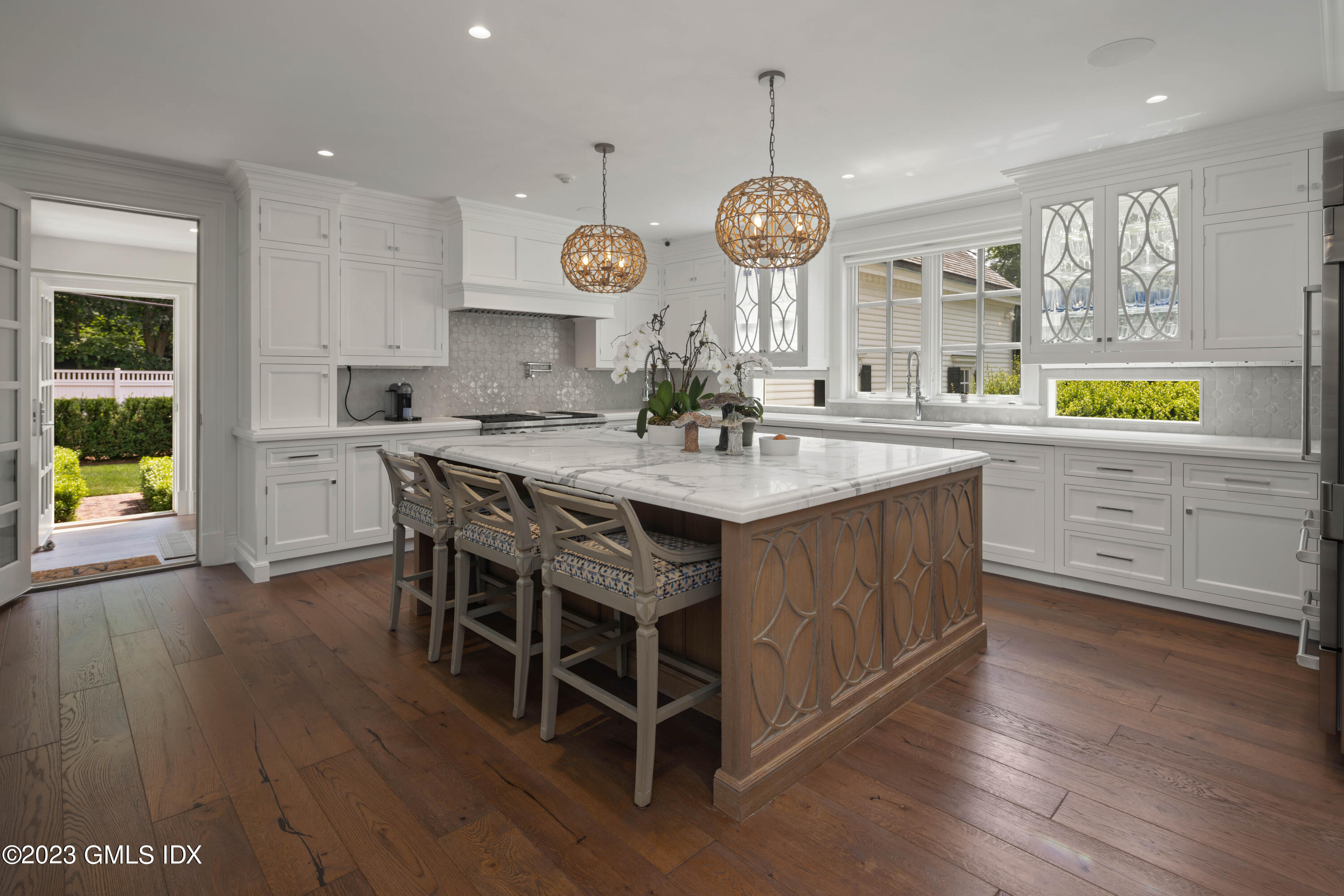 80 Round Hill Road Greenwich, CT 06831 - Photo 18 of 57 a kitchen with a table chairs and a chandelier