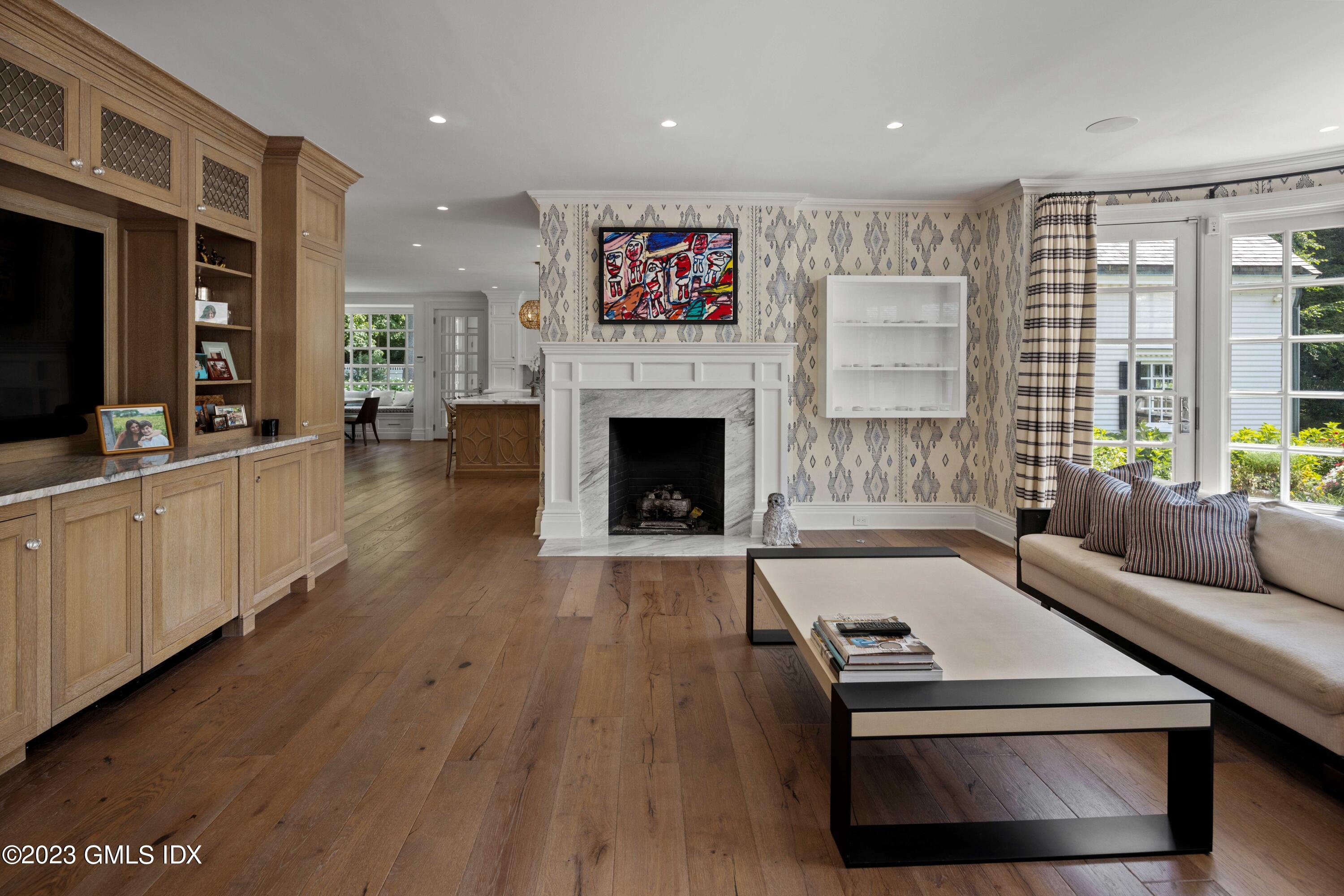 80 Round Hill Road Greenwich, CT 06831 - Photo 21 of 57 a living room with furniture and a fireplace