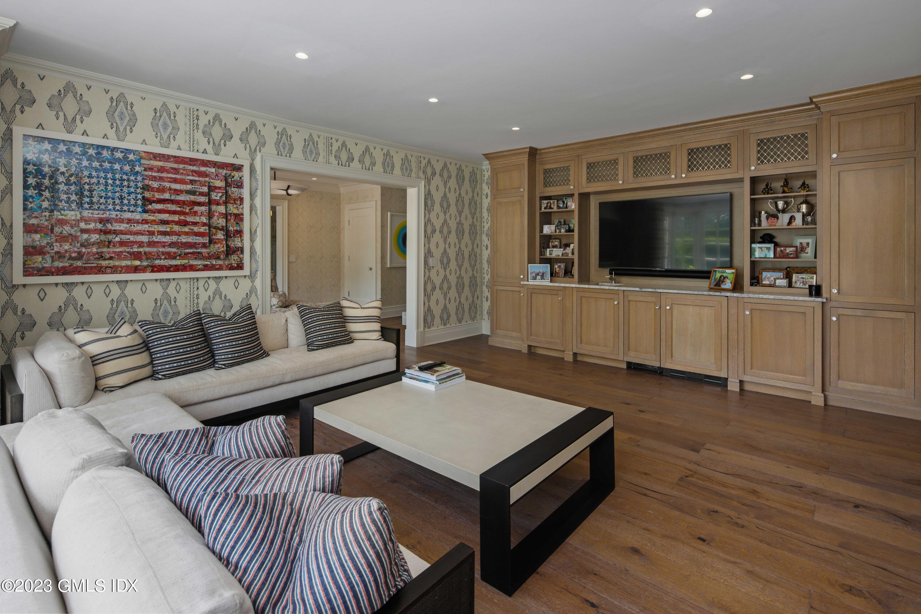 80 Round Hill Road Greenwich, CT 06831 - Photo 22 of 57 a living room with furniture and a flat screen tv