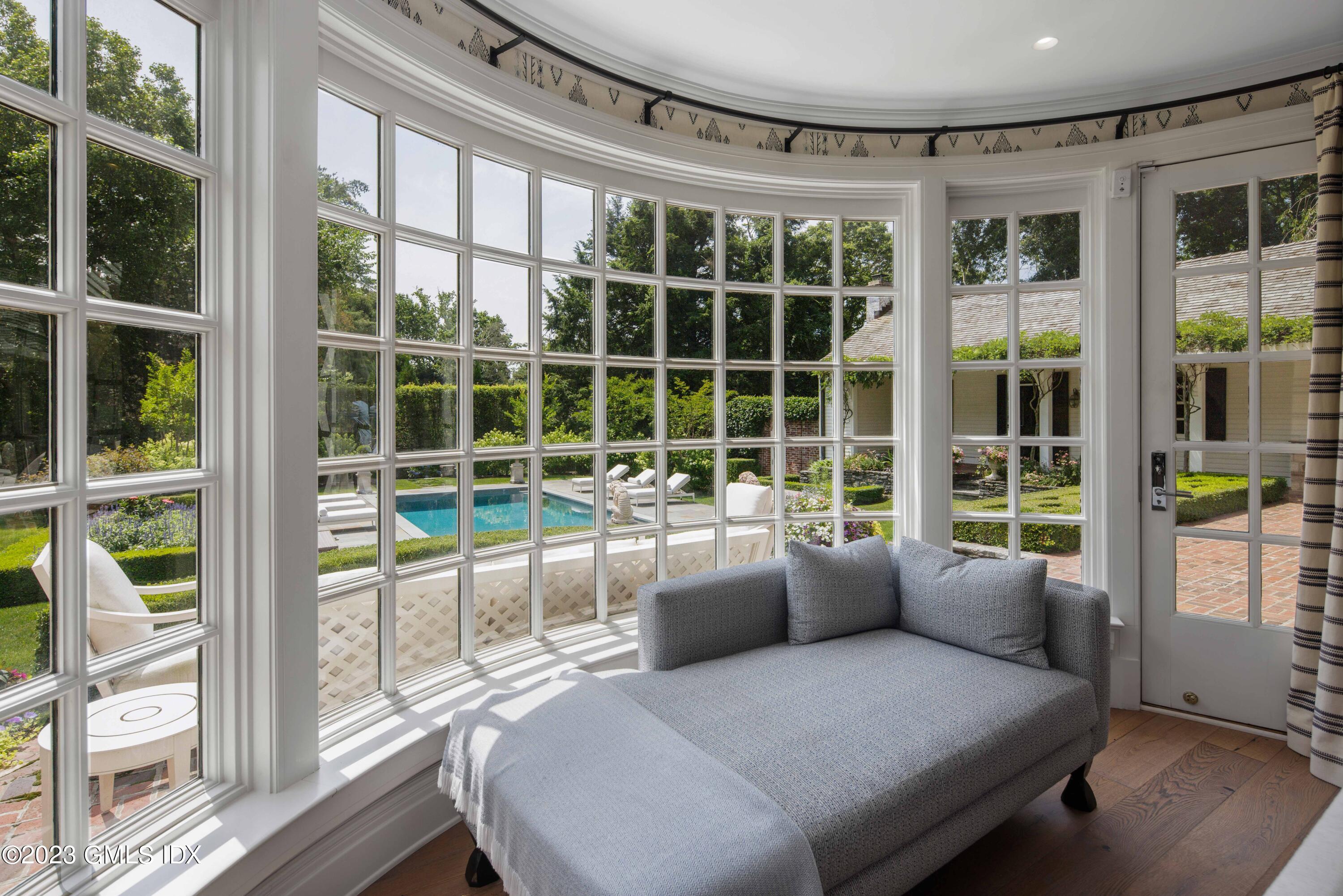 80 Round Hill Road Greenwich, CT 06831 - Photo 23 of 57 a view of a living room and windows