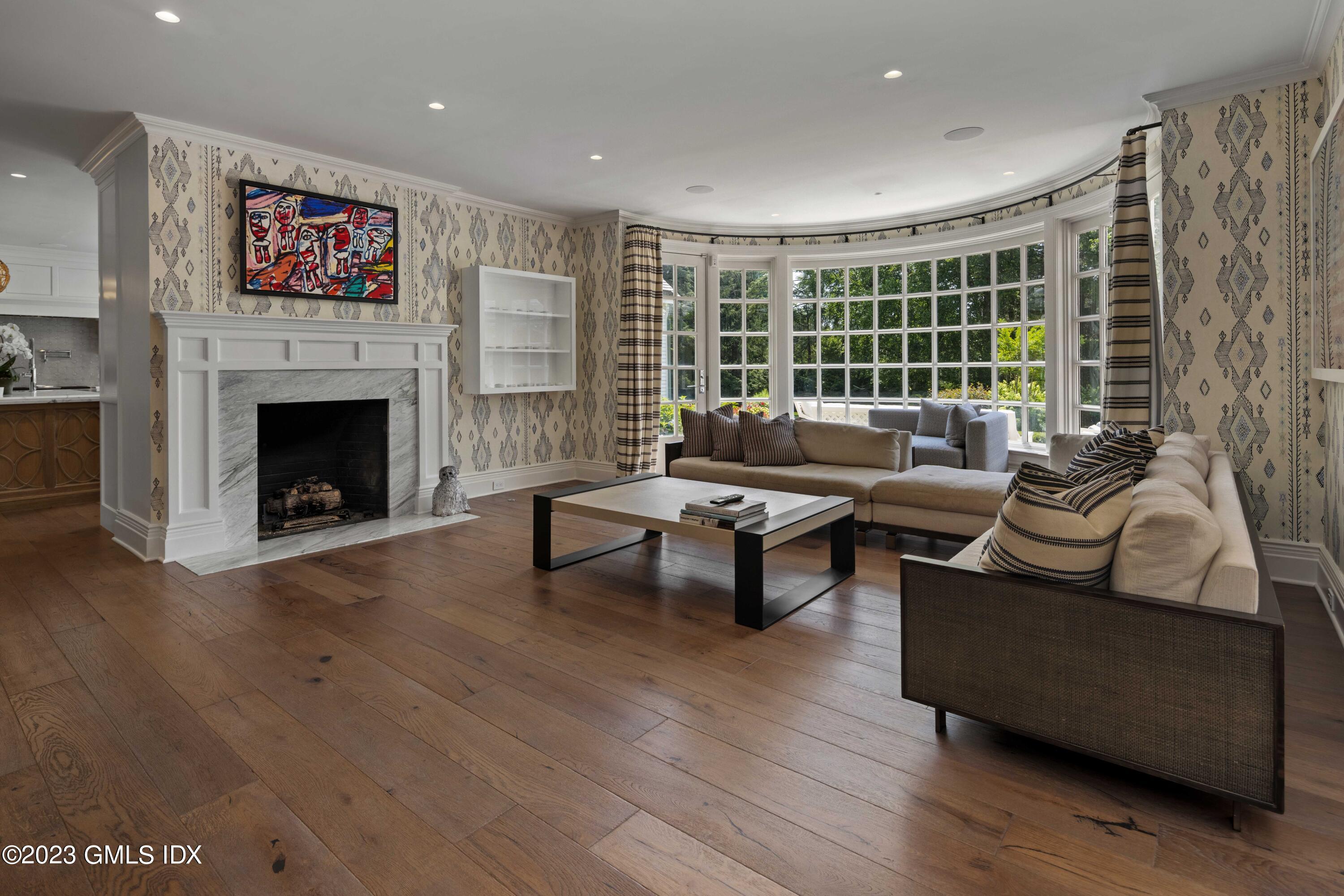 80 Round Hill Road Greenwich, CT 06831 - Photo 24 of 57 a living room with furniture and a fireplace