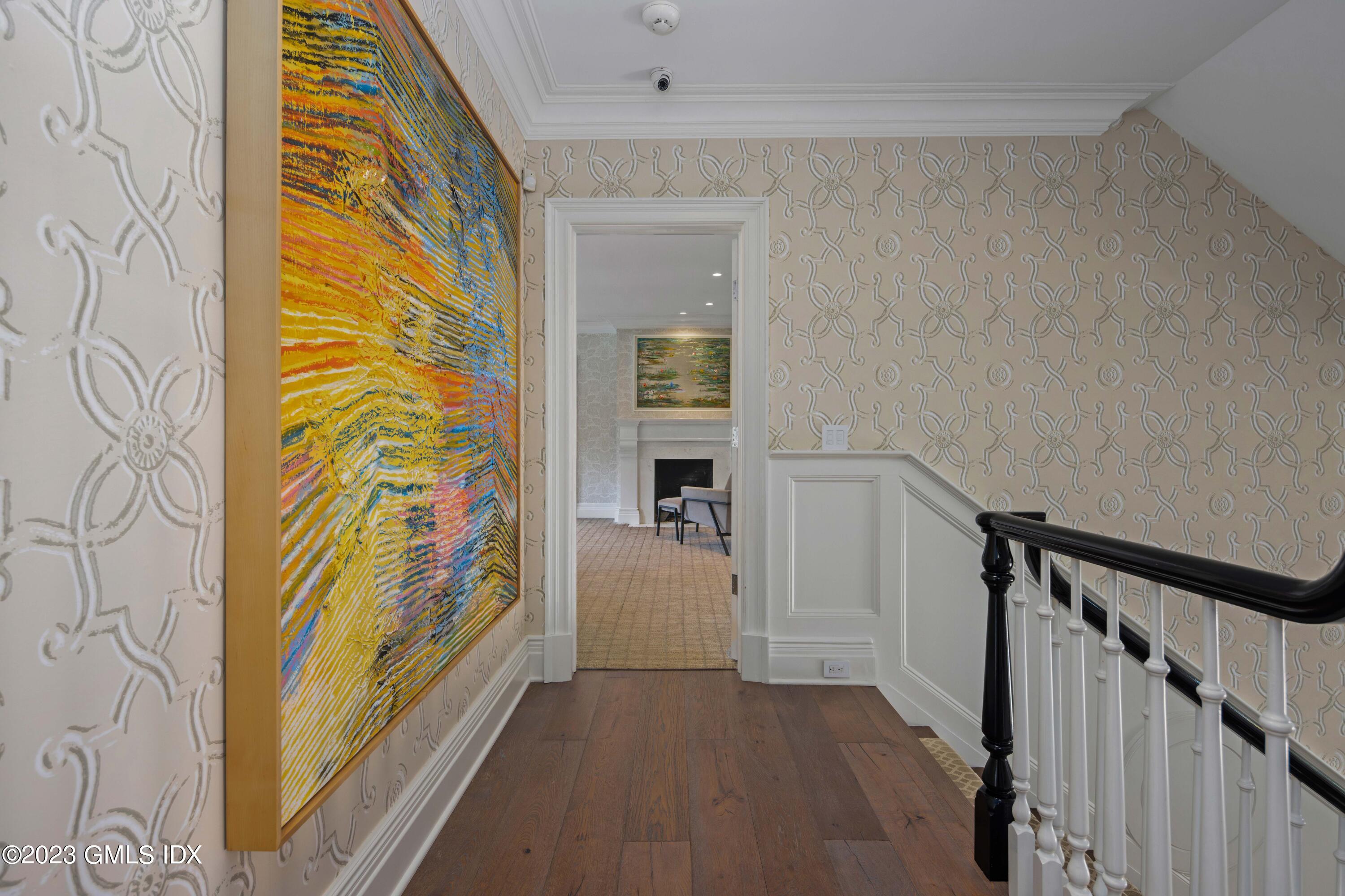 80 Round Hill Road Greenwich, CT 06831 - Photo 25 of 57 a view of hallway with wooden floor and stairs