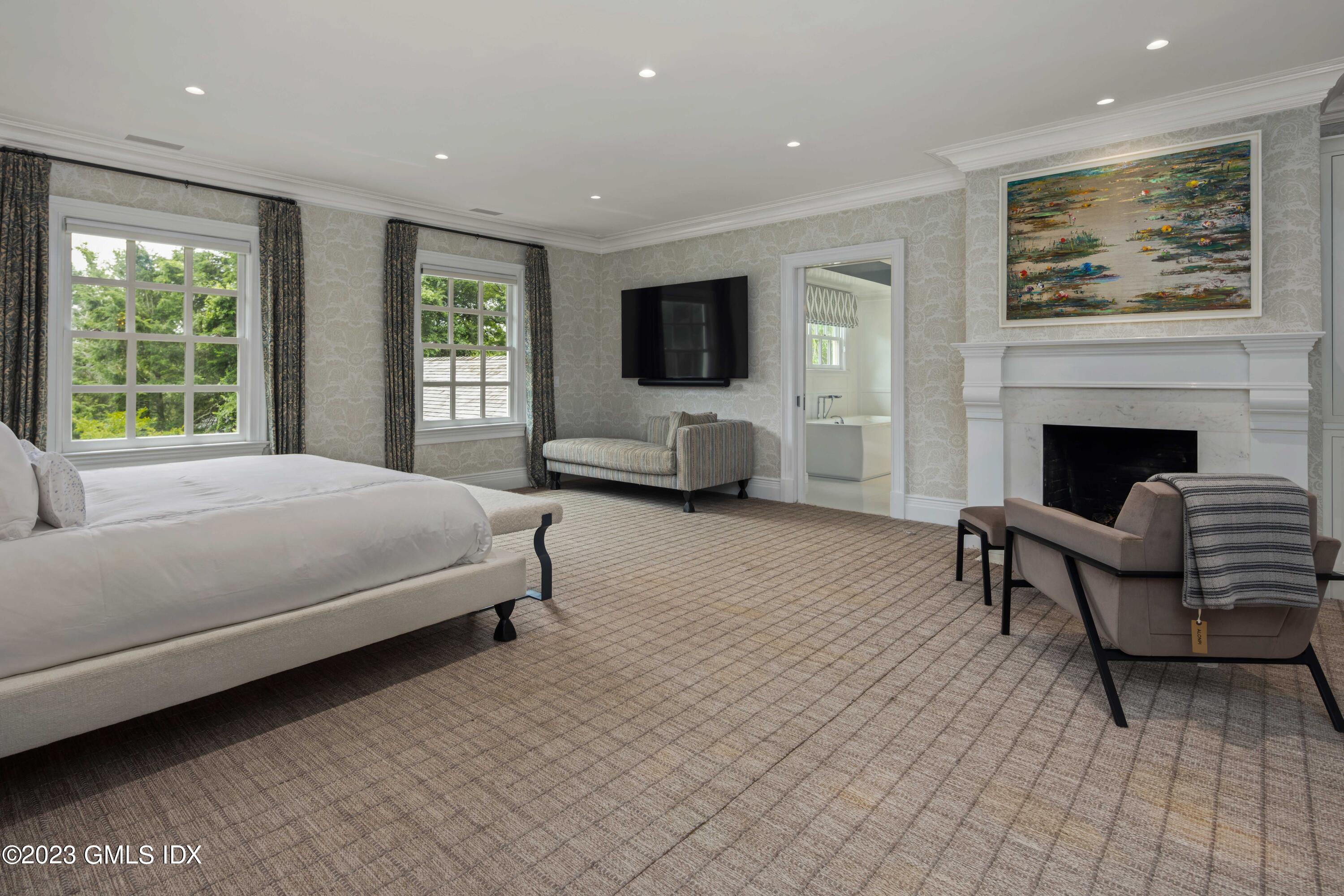 80 Round Hill Road Greenwich, CT 06831 - Photo 26 of 57 a bedroom with a bed and a couch