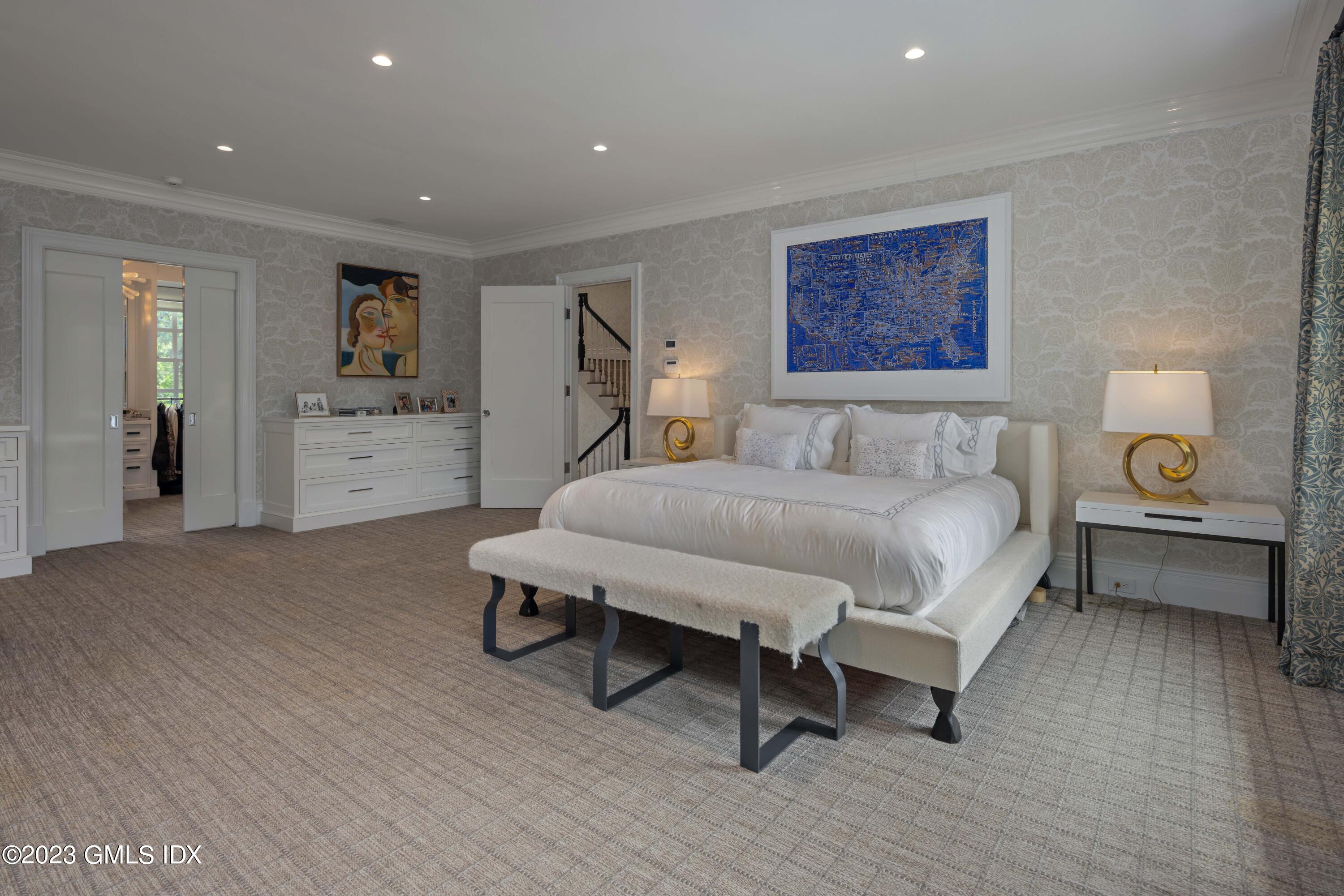 80 Round Hill Road Greenwich, CT 06831 - Photo 27 of 57 a spacious bedroom with a bed and a desk