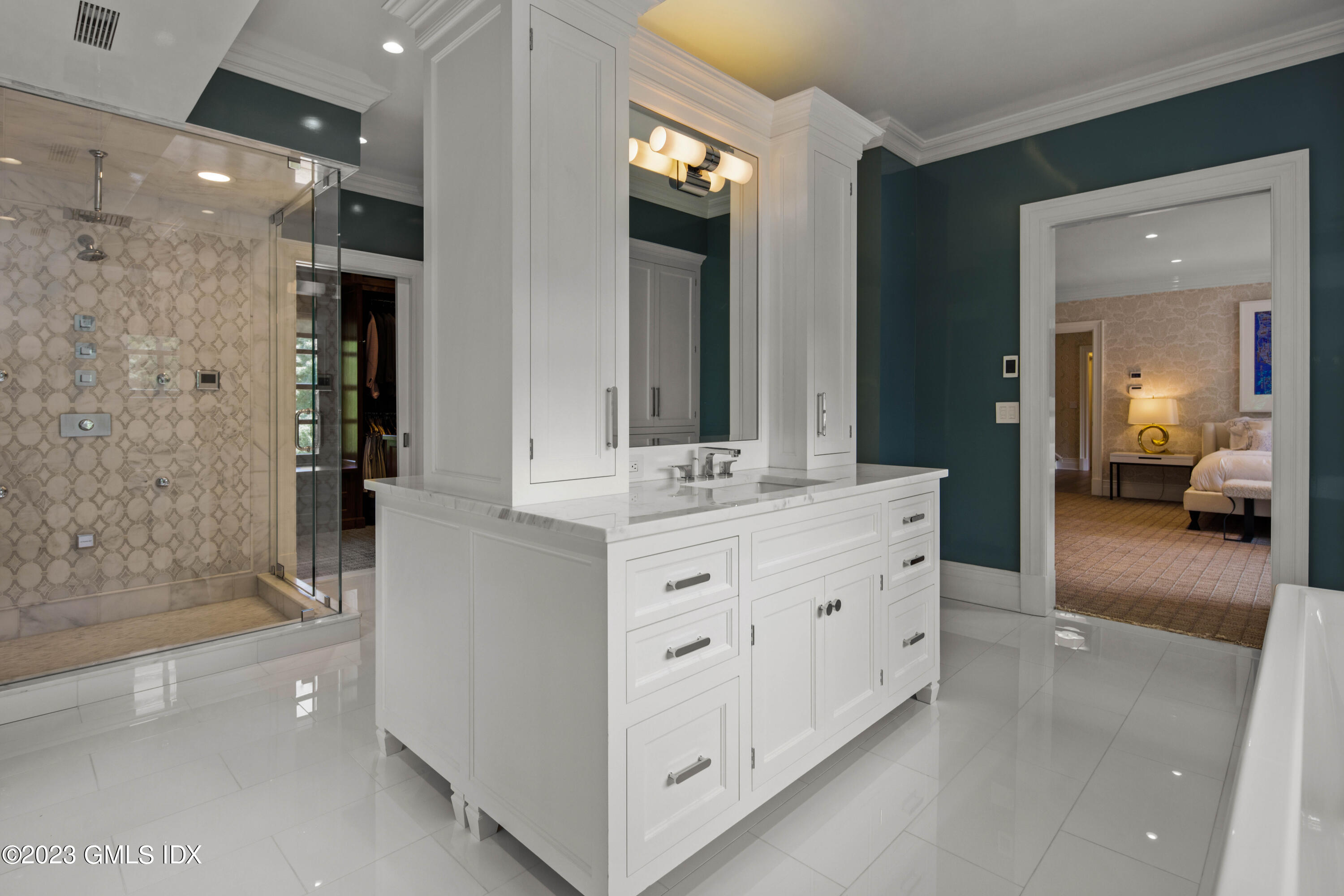 80 Round Hill Road Greenwich, CT 06831 - Photo 30 of 57 a large bathroom with a double vanity sink and a mirror